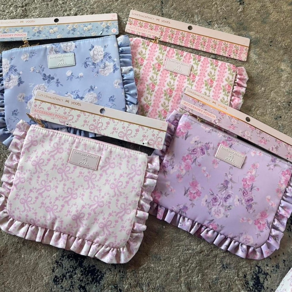 LoveShackFancy & Yoobi floral accessory pouches in pink purple blue & white bows